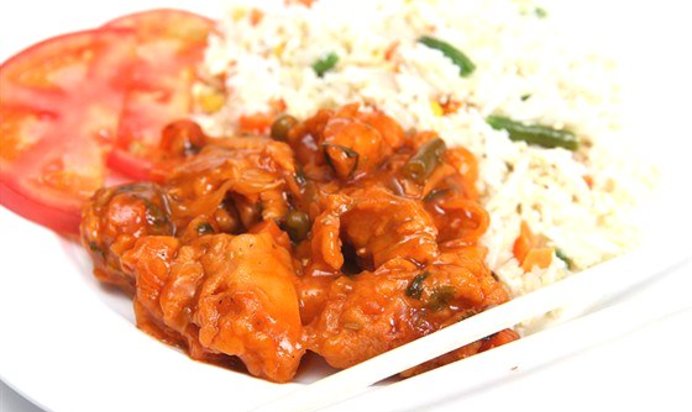 Сладкие куриные грудки во фритюре с зеленым луком, рисовым вином и цедрой апельсина