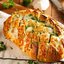 Батон запеченный с сыром и чесноком в духовке